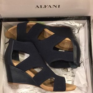 Alfani wedge sandles, upper navy blue woven material with back zipper. Worn once